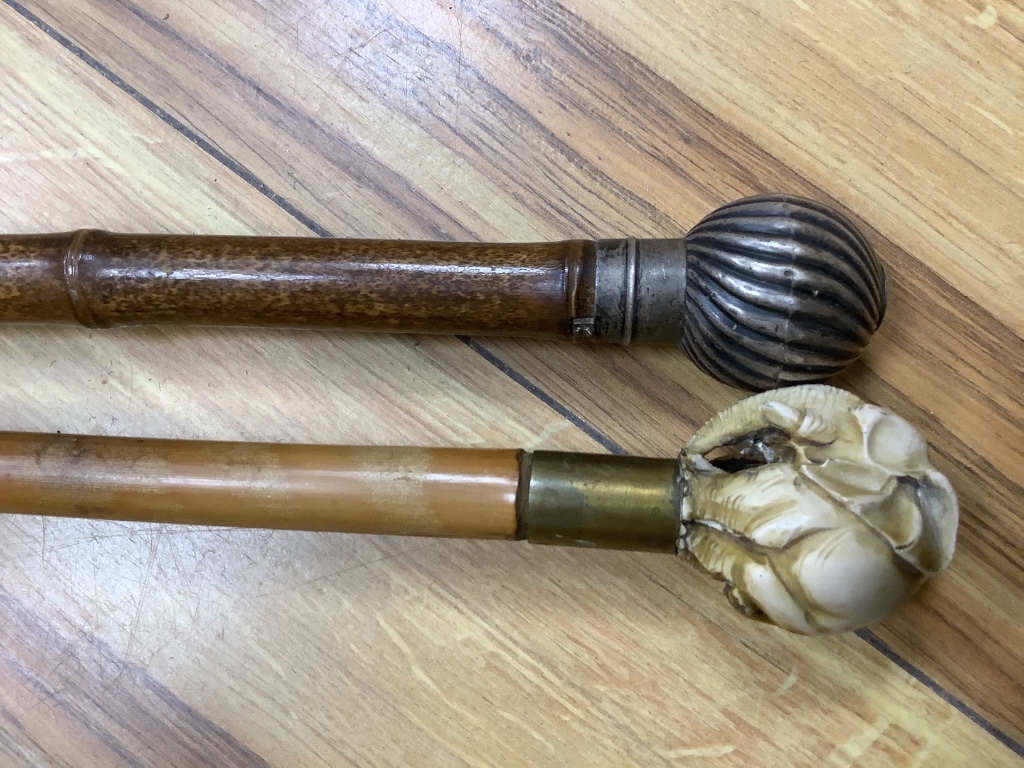 A silver mounted cane and one other faux ivory cane, longest 92cm